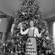 Image for article titled 70 Years of First Ladies Standing in Front of Christmas Trees